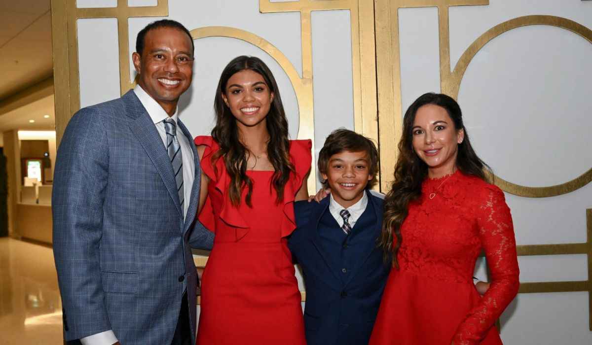 Tiger Woods poses with his daughter, Sam, son, Charlie and girlfriend Erica Herman